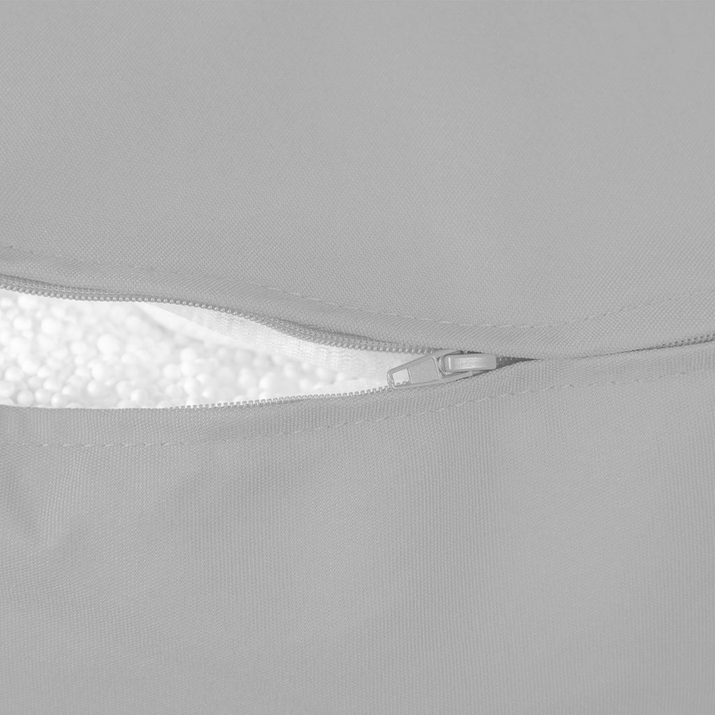 Close-up of a gray fabric with a zipper detail on a light gray background