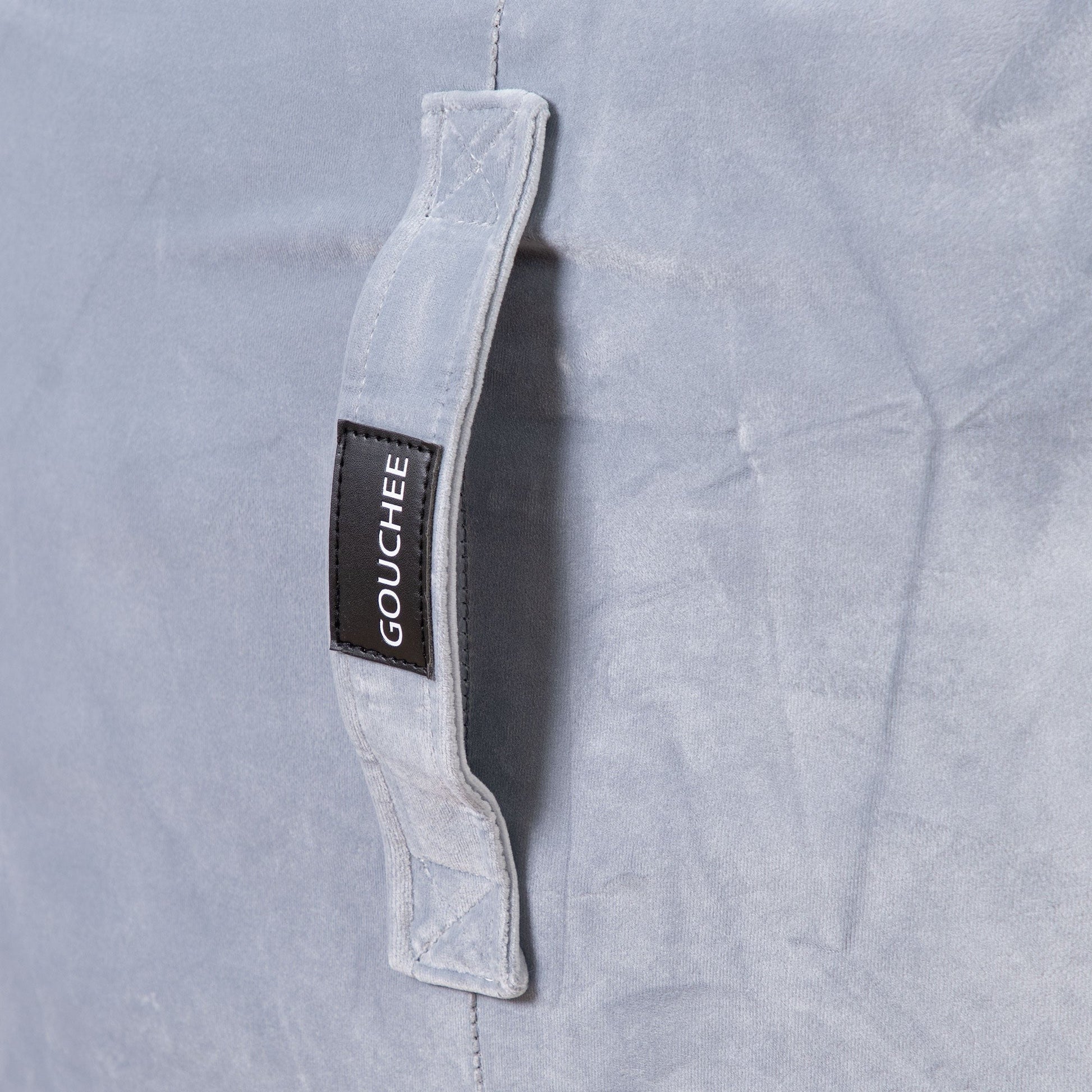 Gray shirt with a visible 'Gouchee' label on a gray background