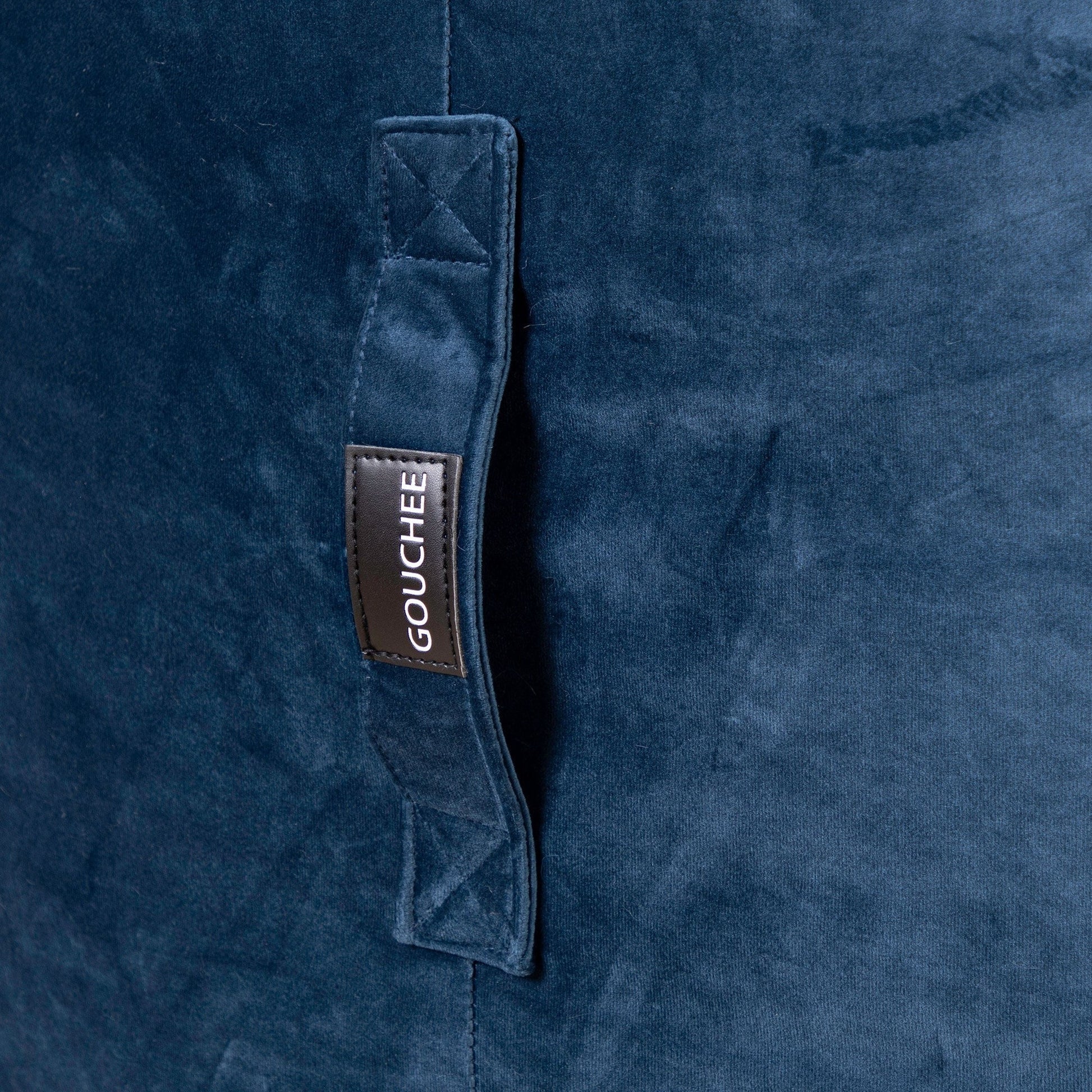 Close-up of a blue fabric with a Gouchee label.