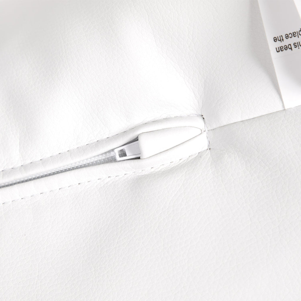 Close-up of a white garment with a zipper on a white background