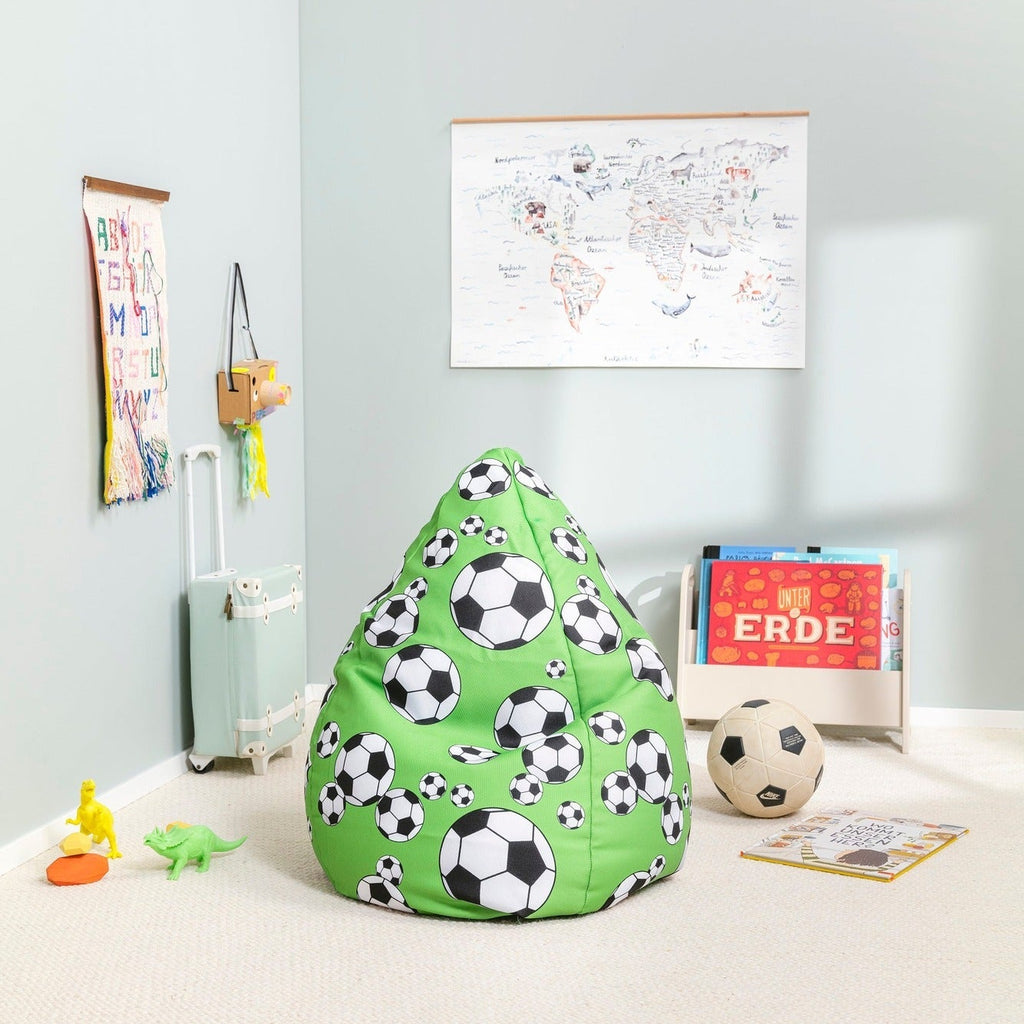 Green bean bag chair with soccer ball pattern in a room with toys and books.