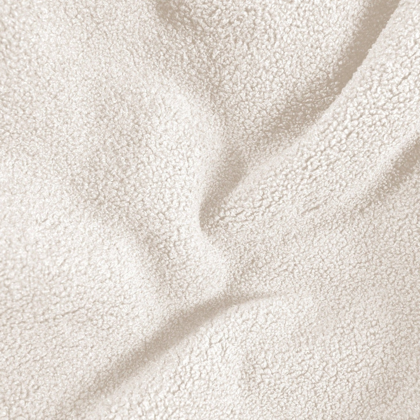 Close-up of beige fleece fabric with soft texture