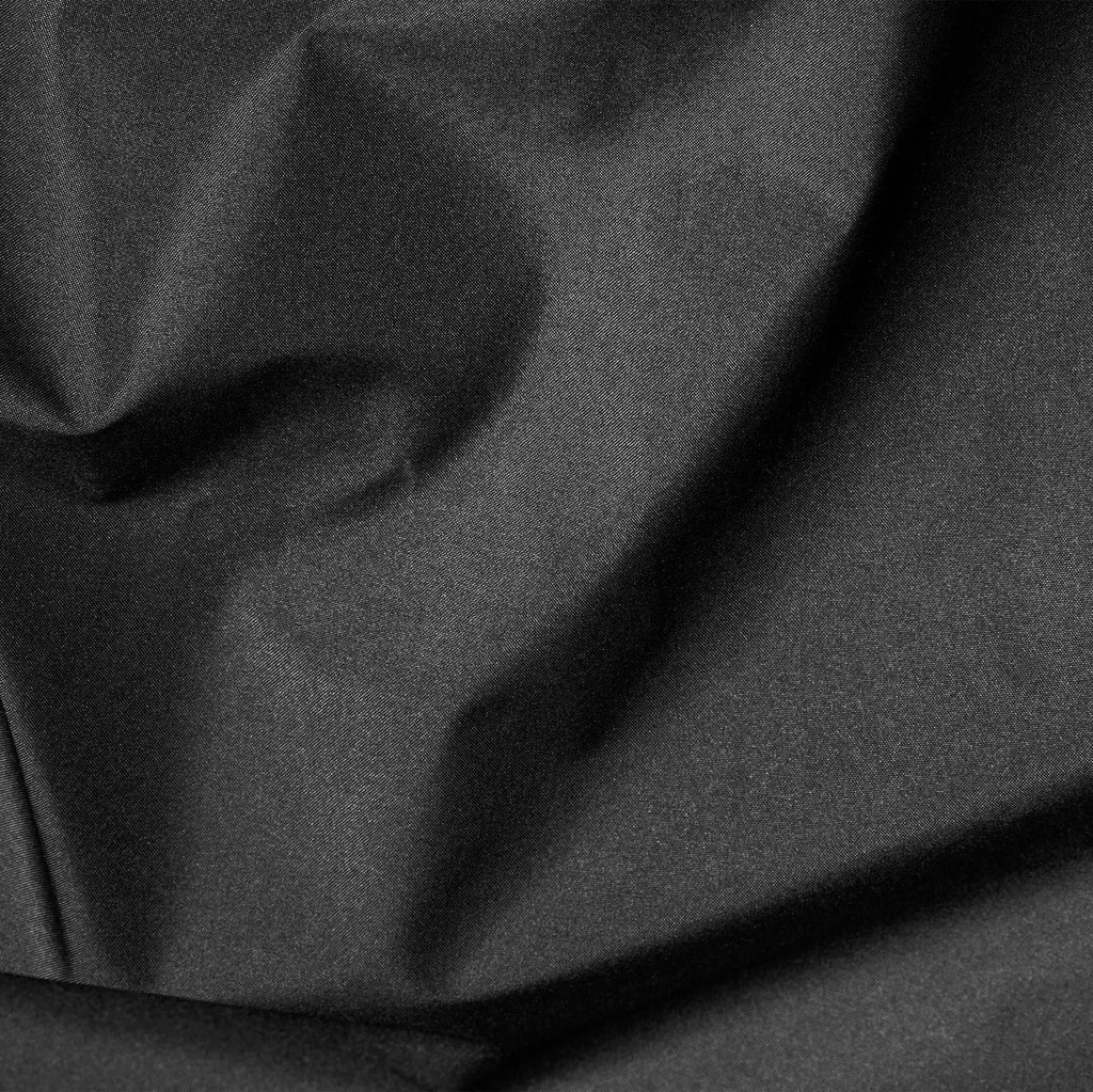 Close-up of dark gray fabric with folds