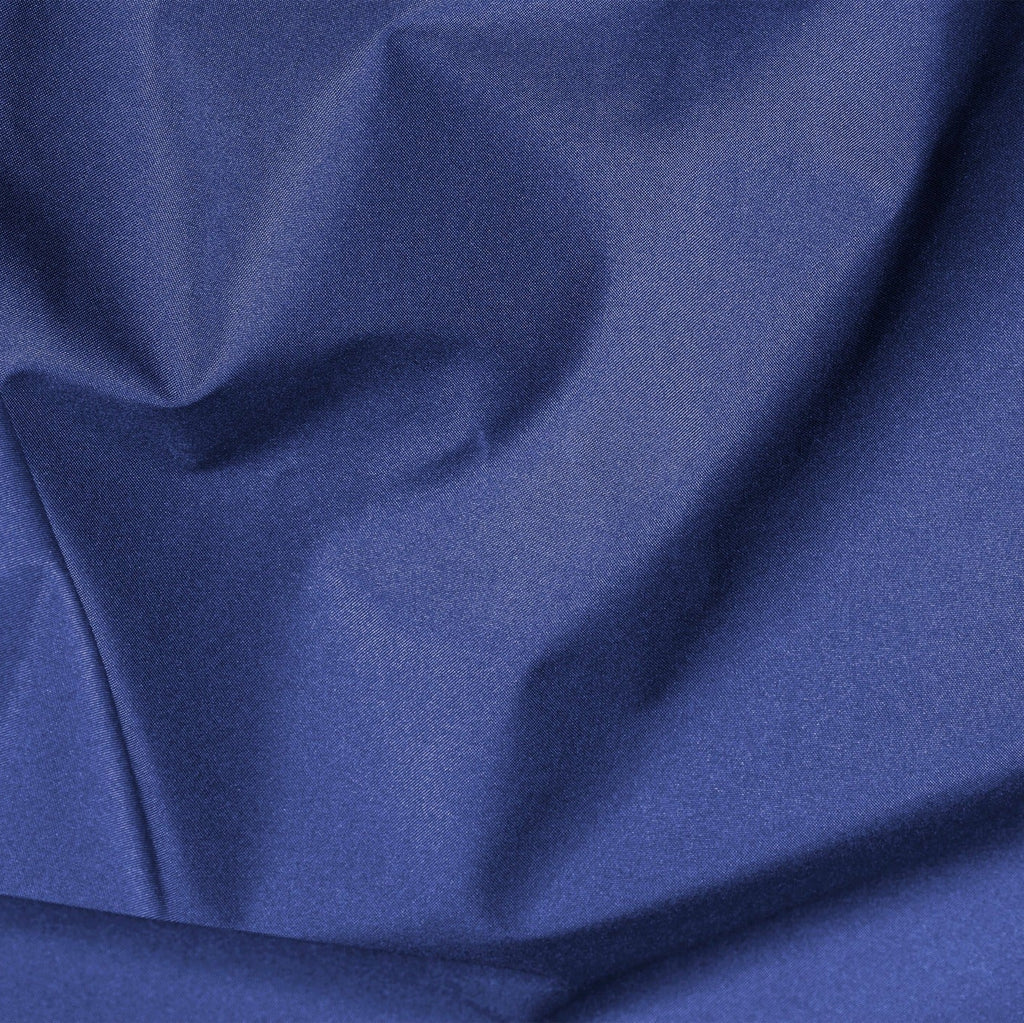Close-up of blue fabric with folds