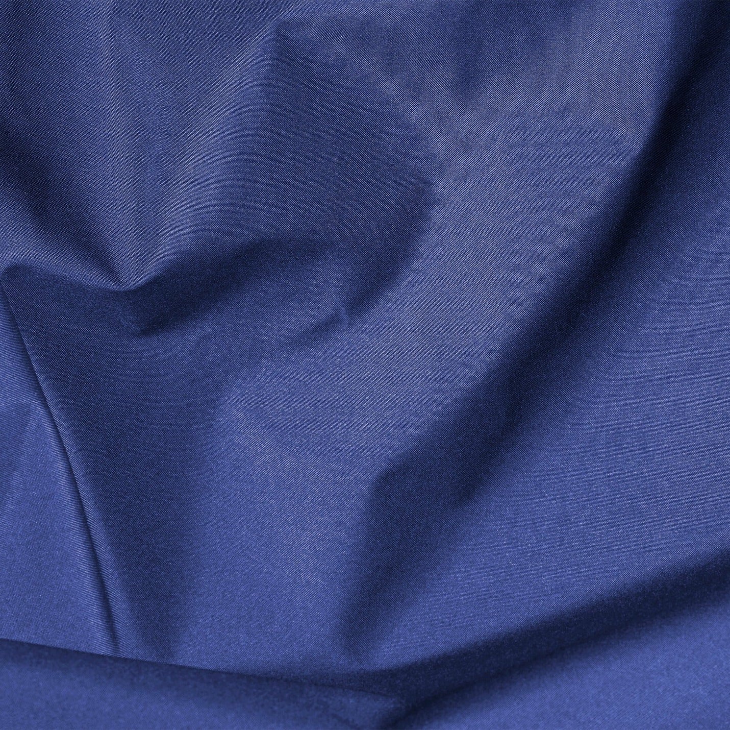 Close-up of blue fabric with folds
