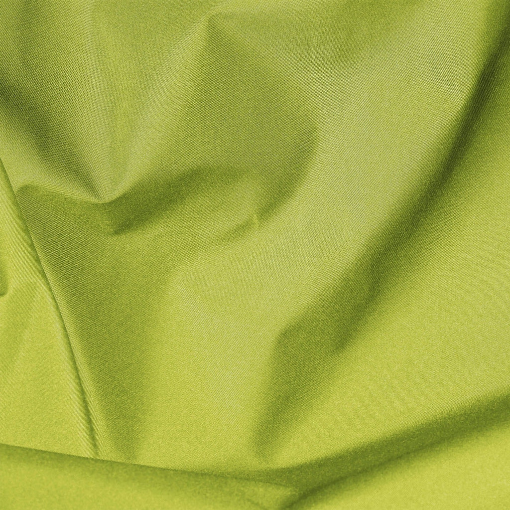 Close-up of green fabric with folds