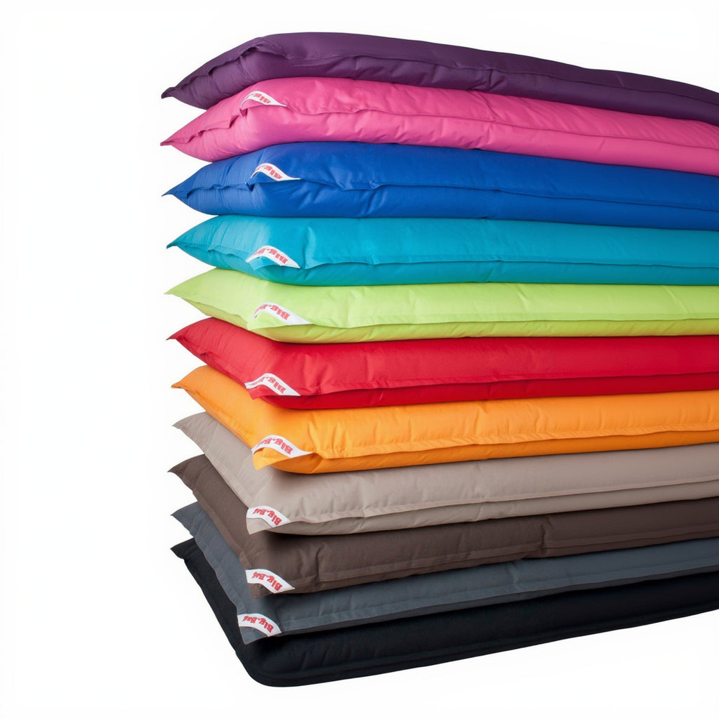 Stack of colorful pillows in various hues with a visible brand logo.