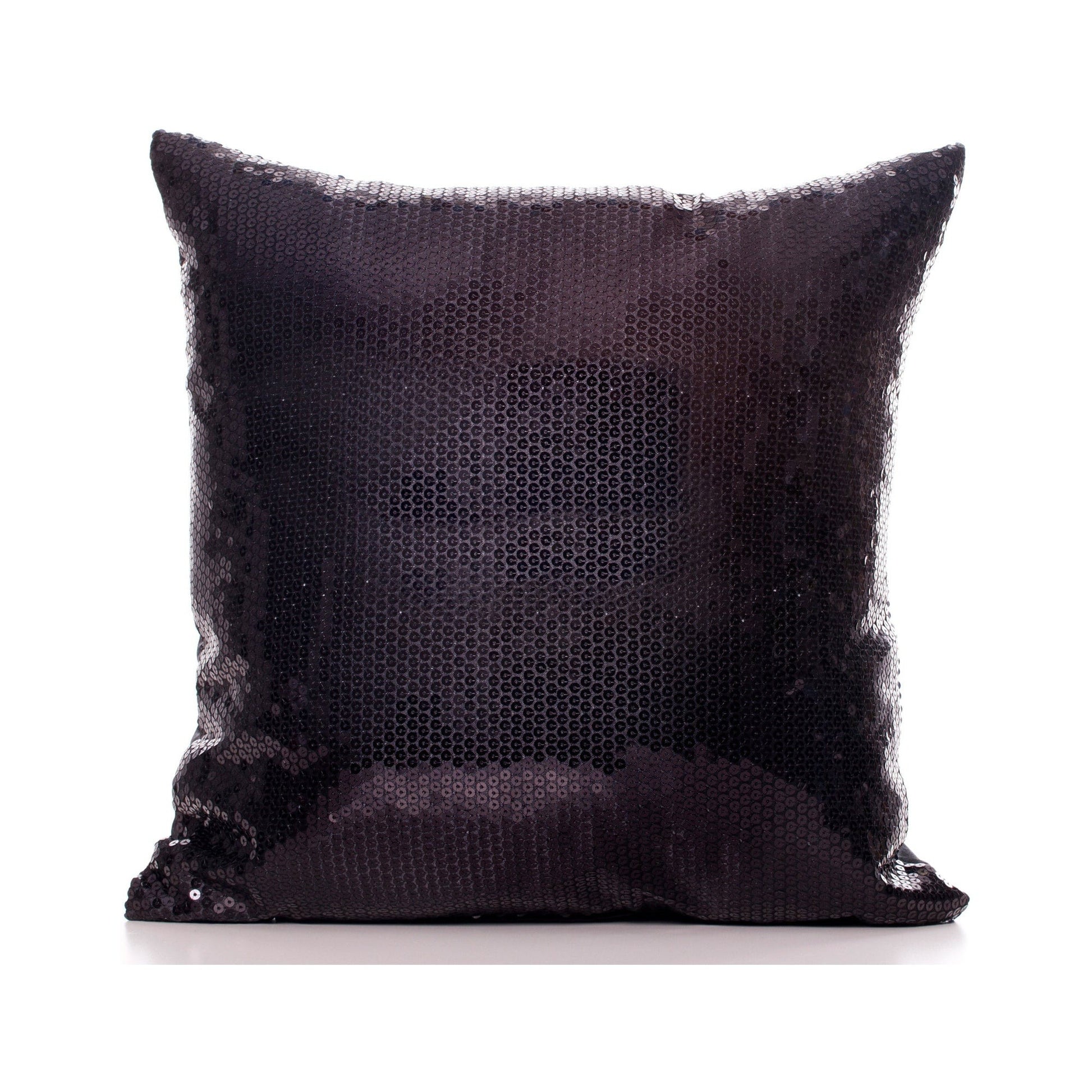 Black sequin pillow on a white background