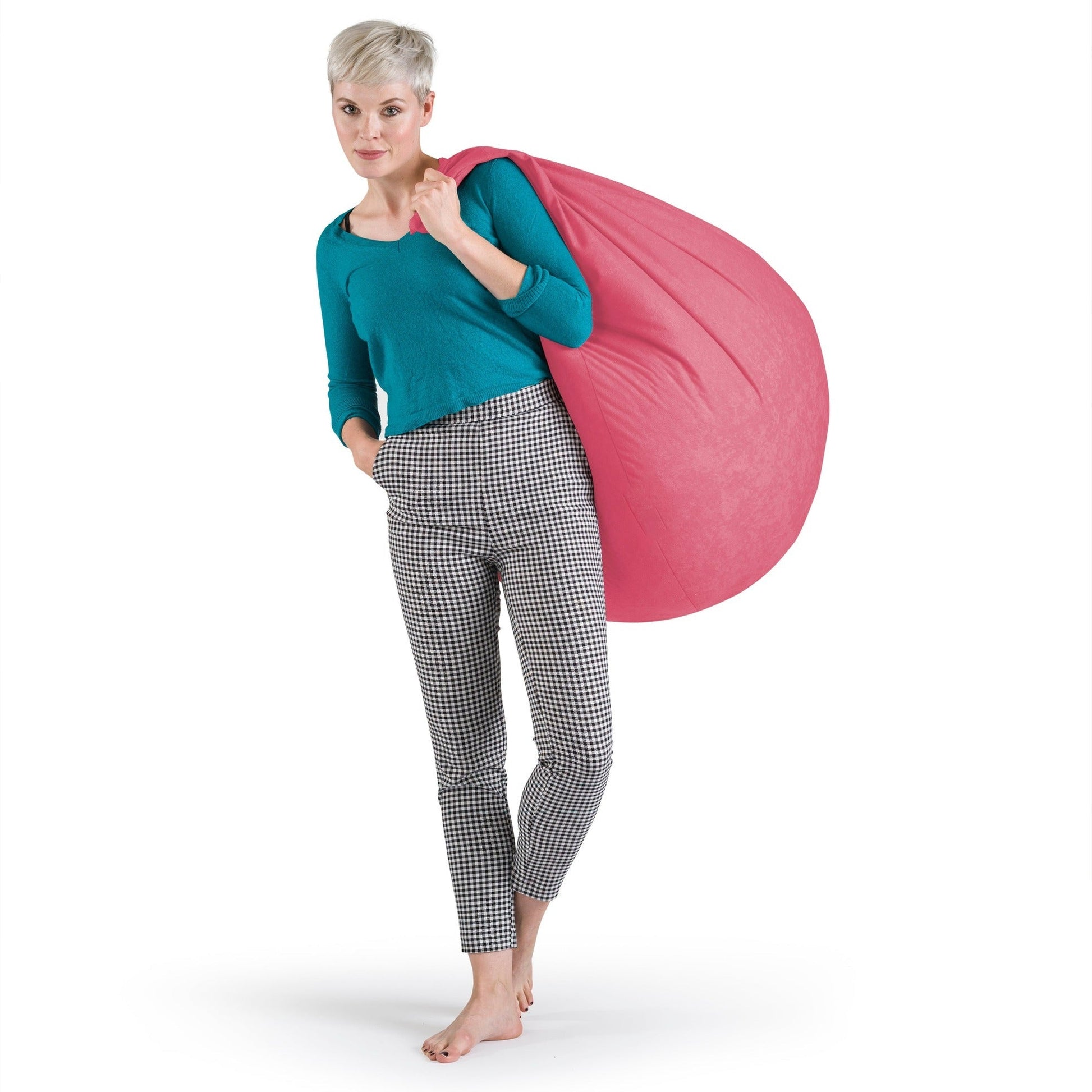 Woman holding a pink bean bag against a white background