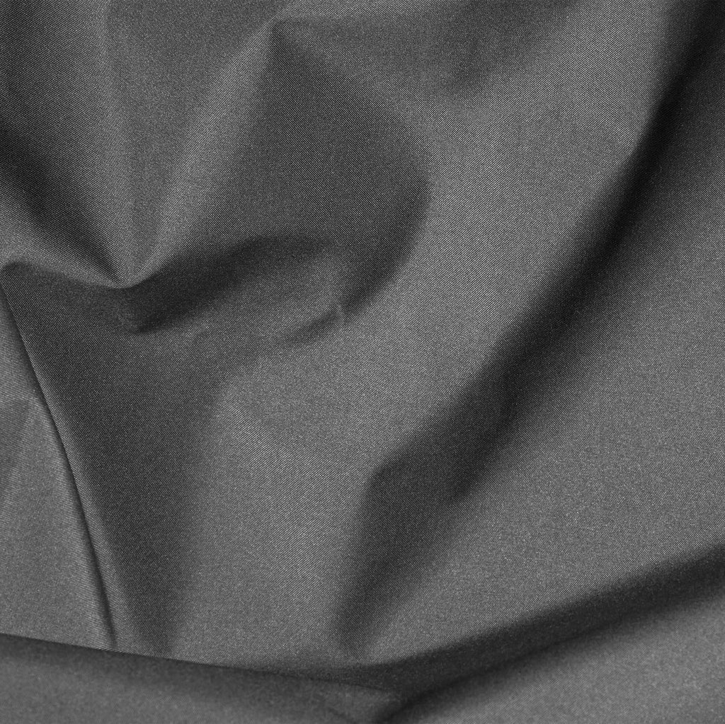 Close-up of dark gray fabric with folds