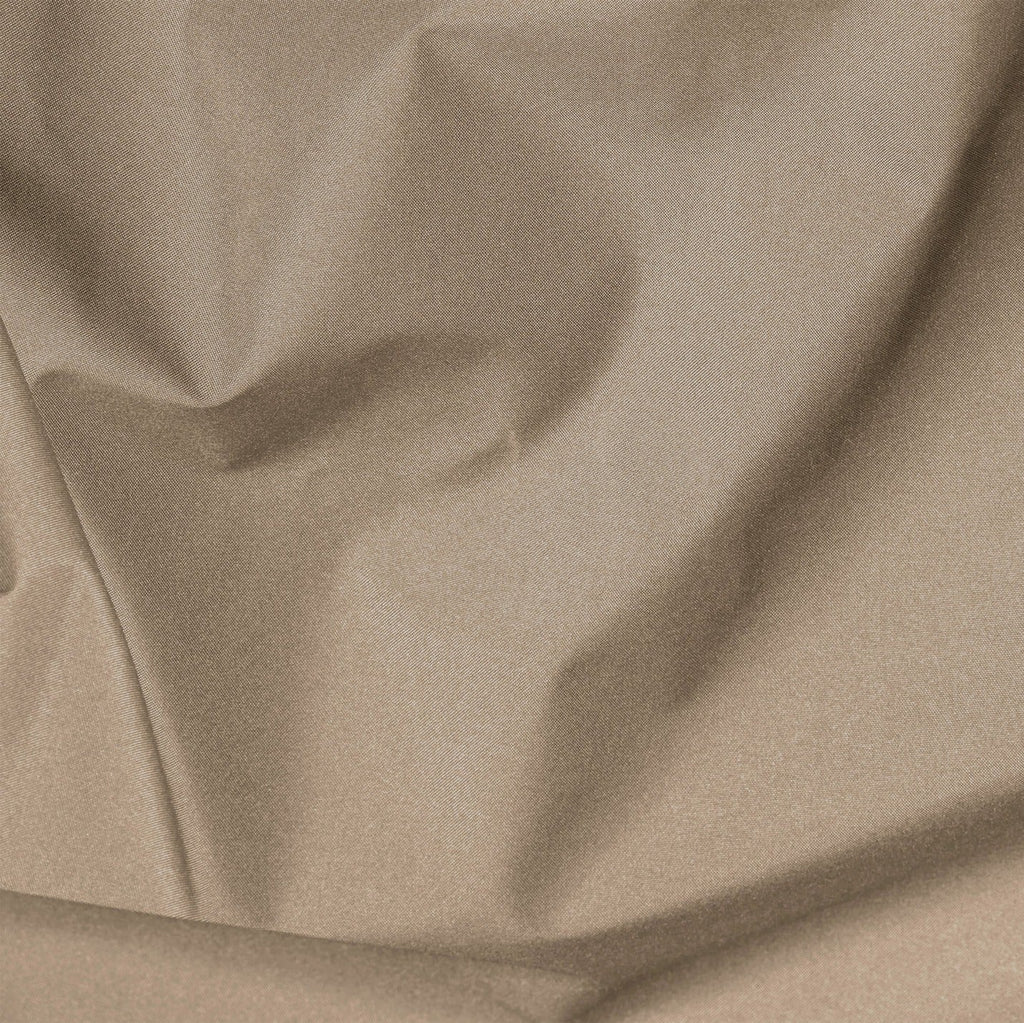 Close-up of beige fabric with folds
