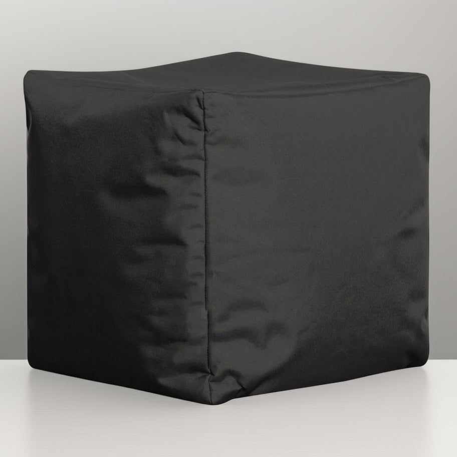 Black cube-shaped ottoman on a white background