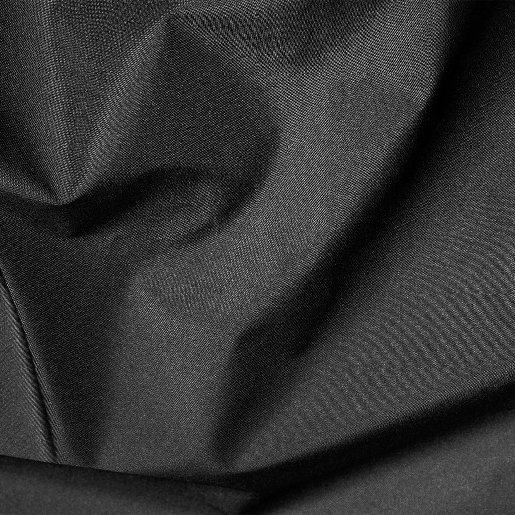 Close-up of dark gray fabric with folds