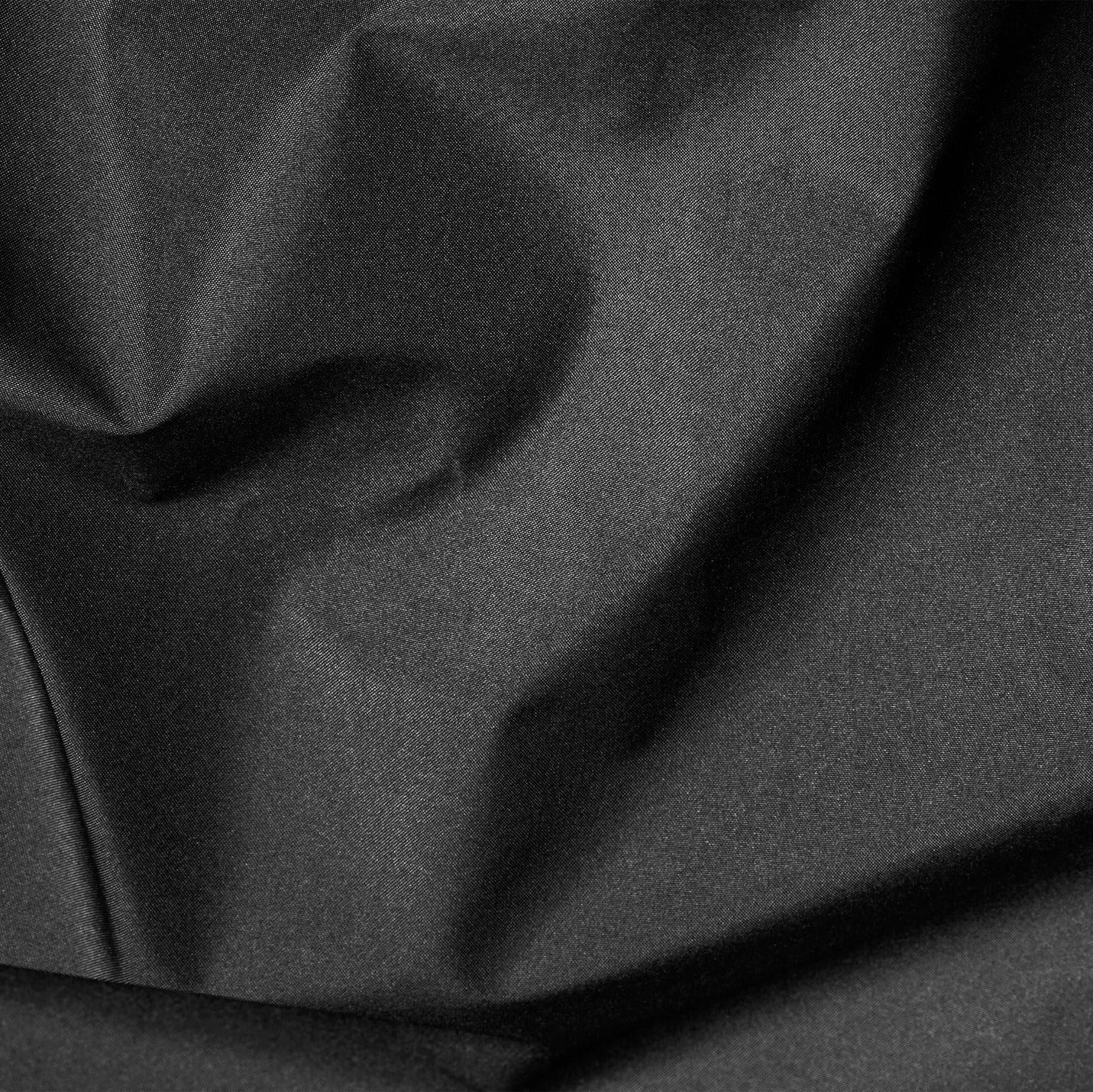 Close-up of dark gray fabric with folds