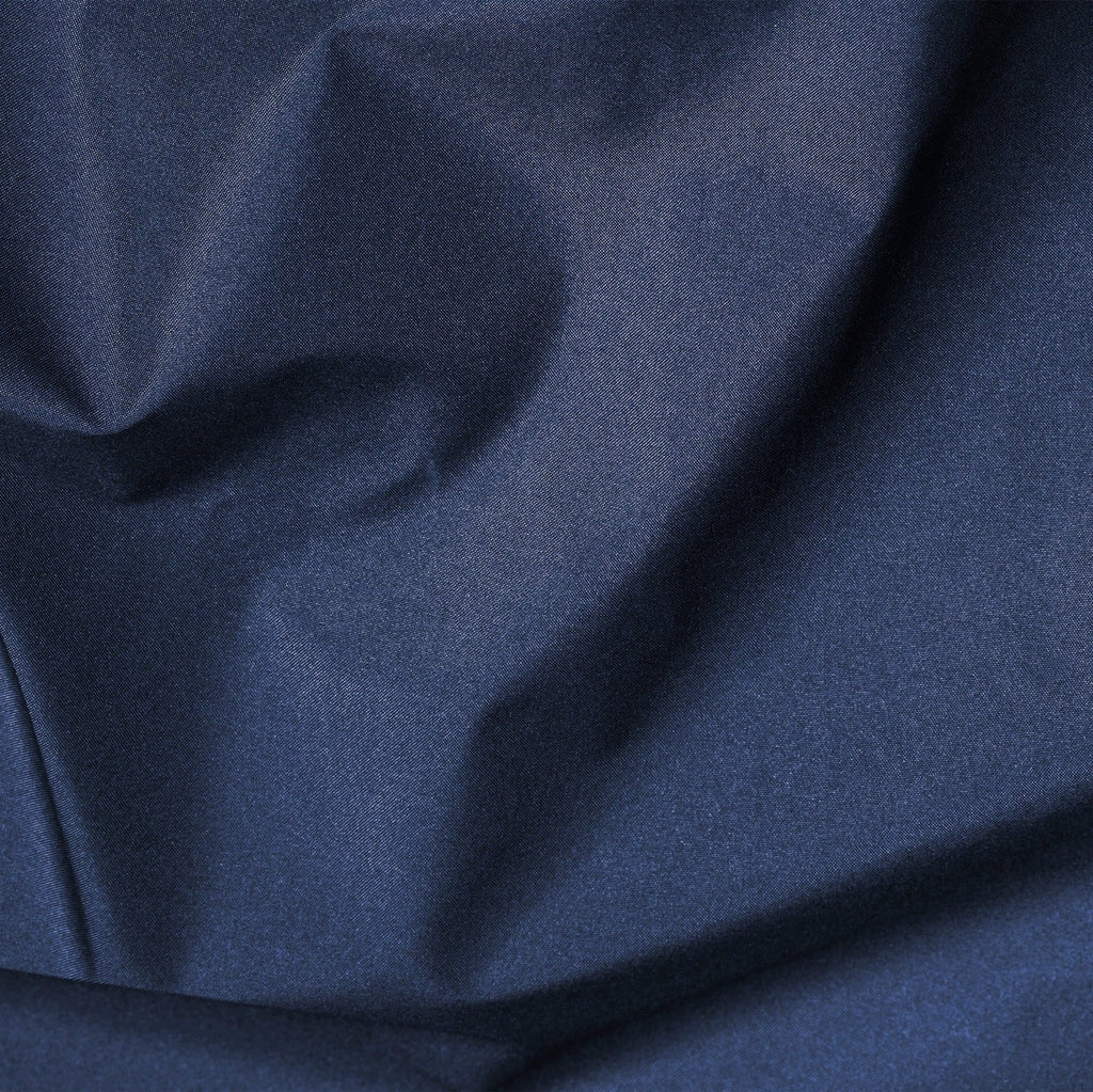 Close-up of dark blue fabric with folds