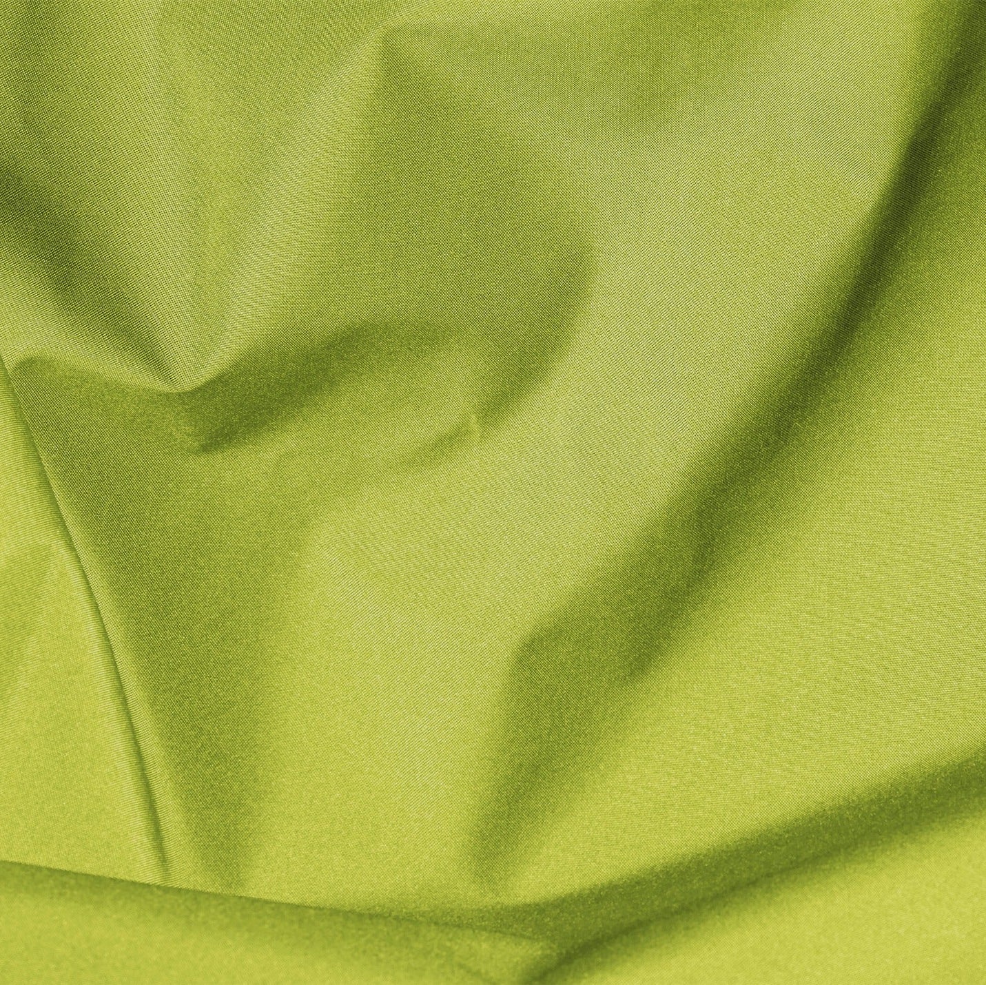 Close-up of green fabric with folds