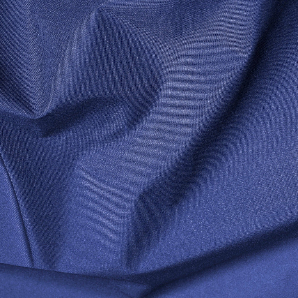 Close-up of blue fabric with folds