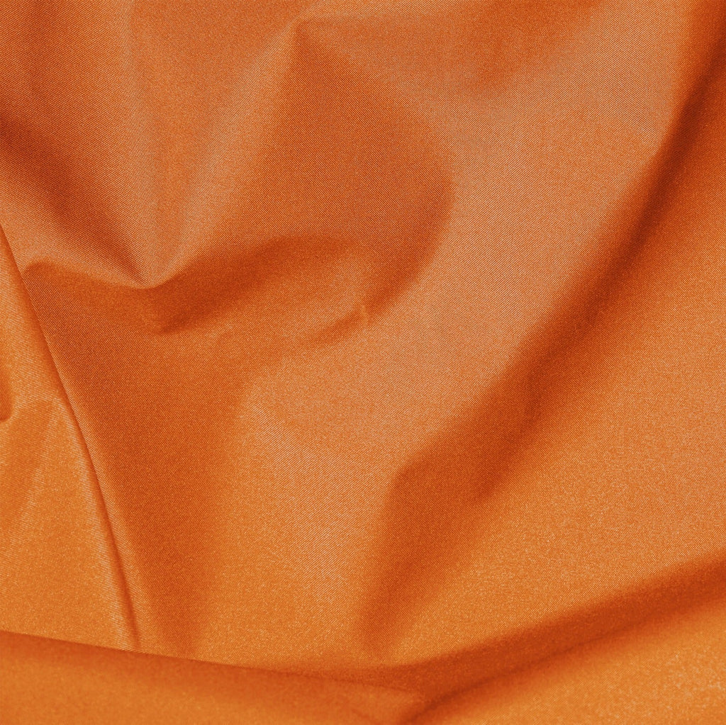 Close-up of orange fabric with visible texture