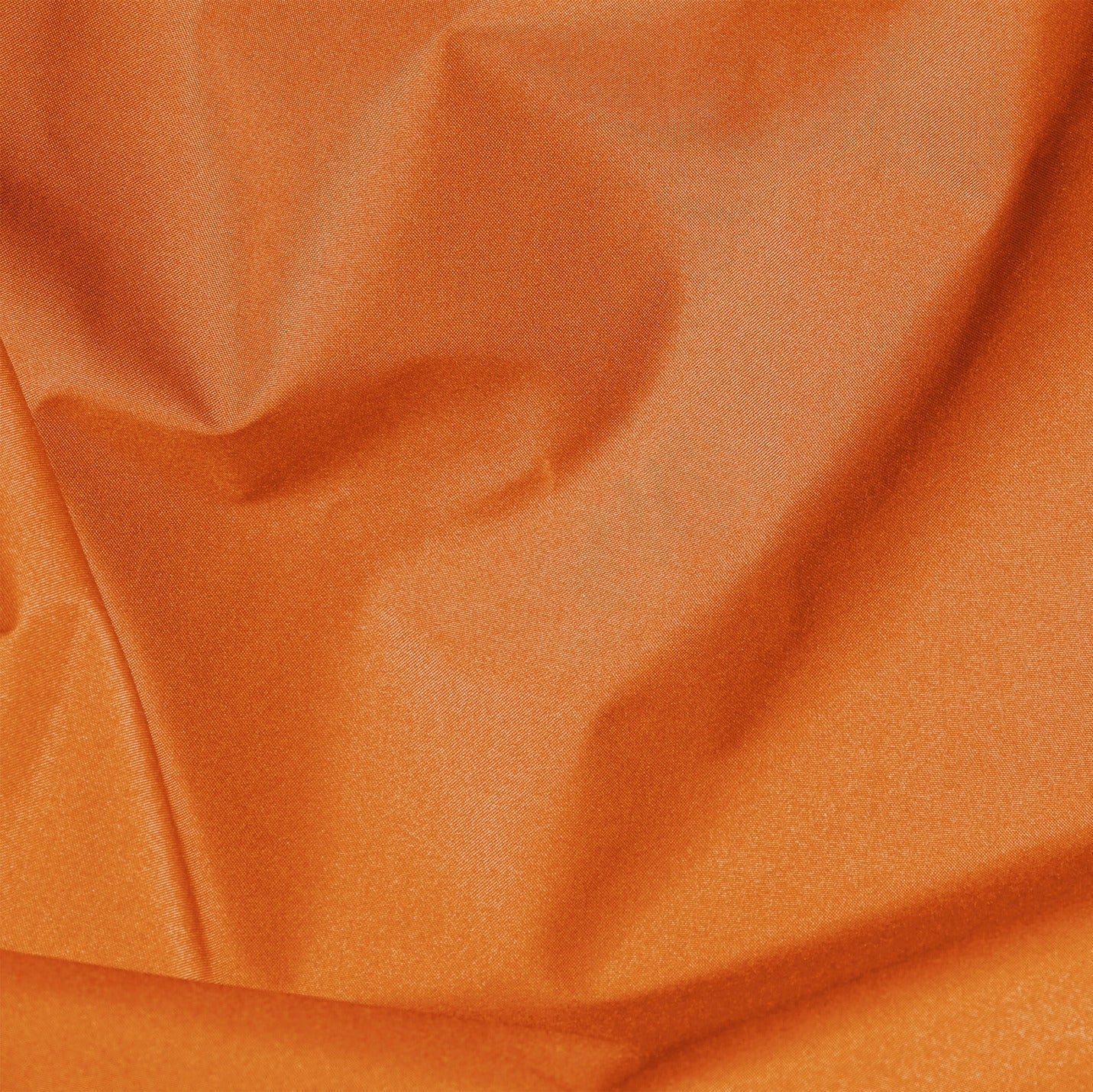 Close-up of orange fabric with visible texture