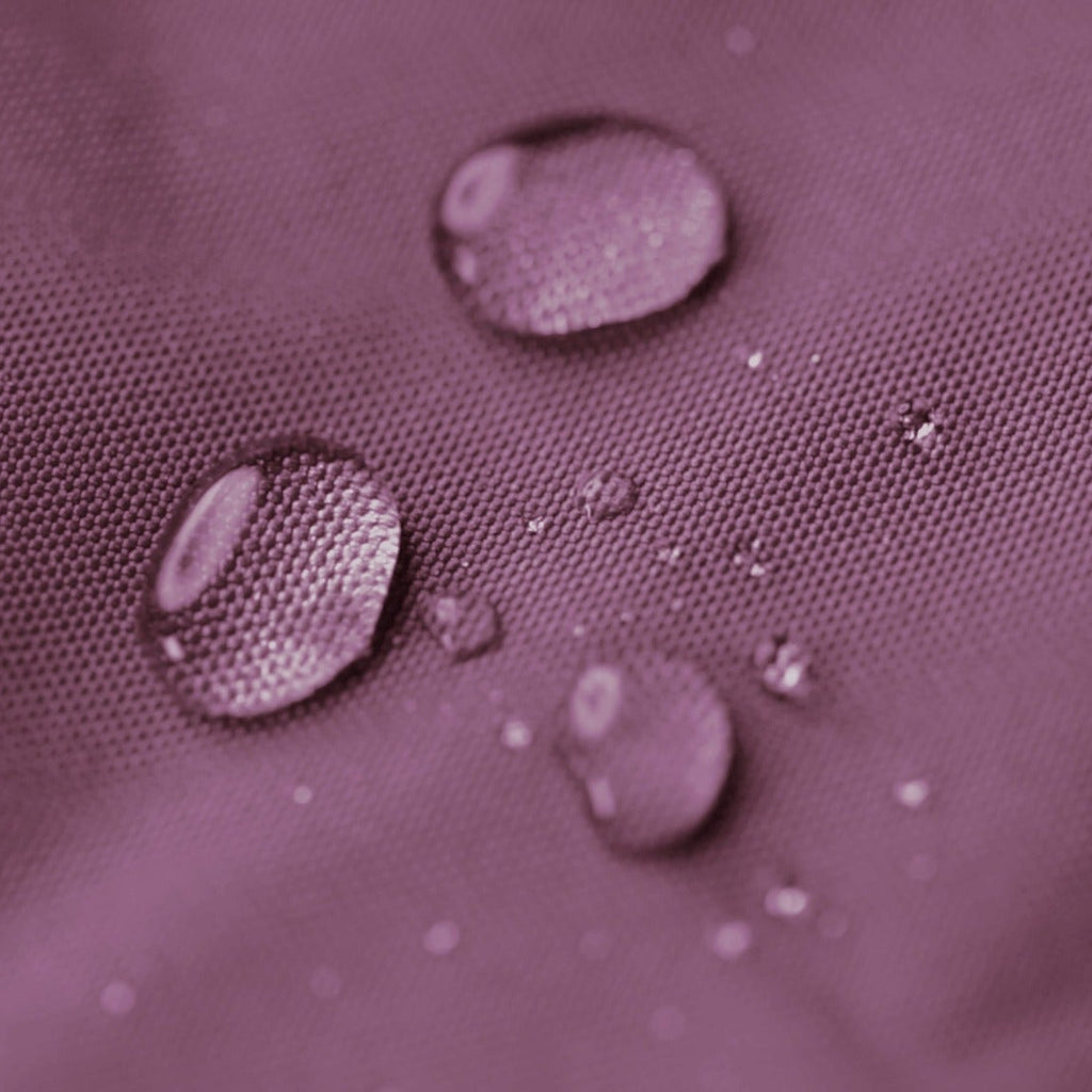 Water droplets on a textured purple surface