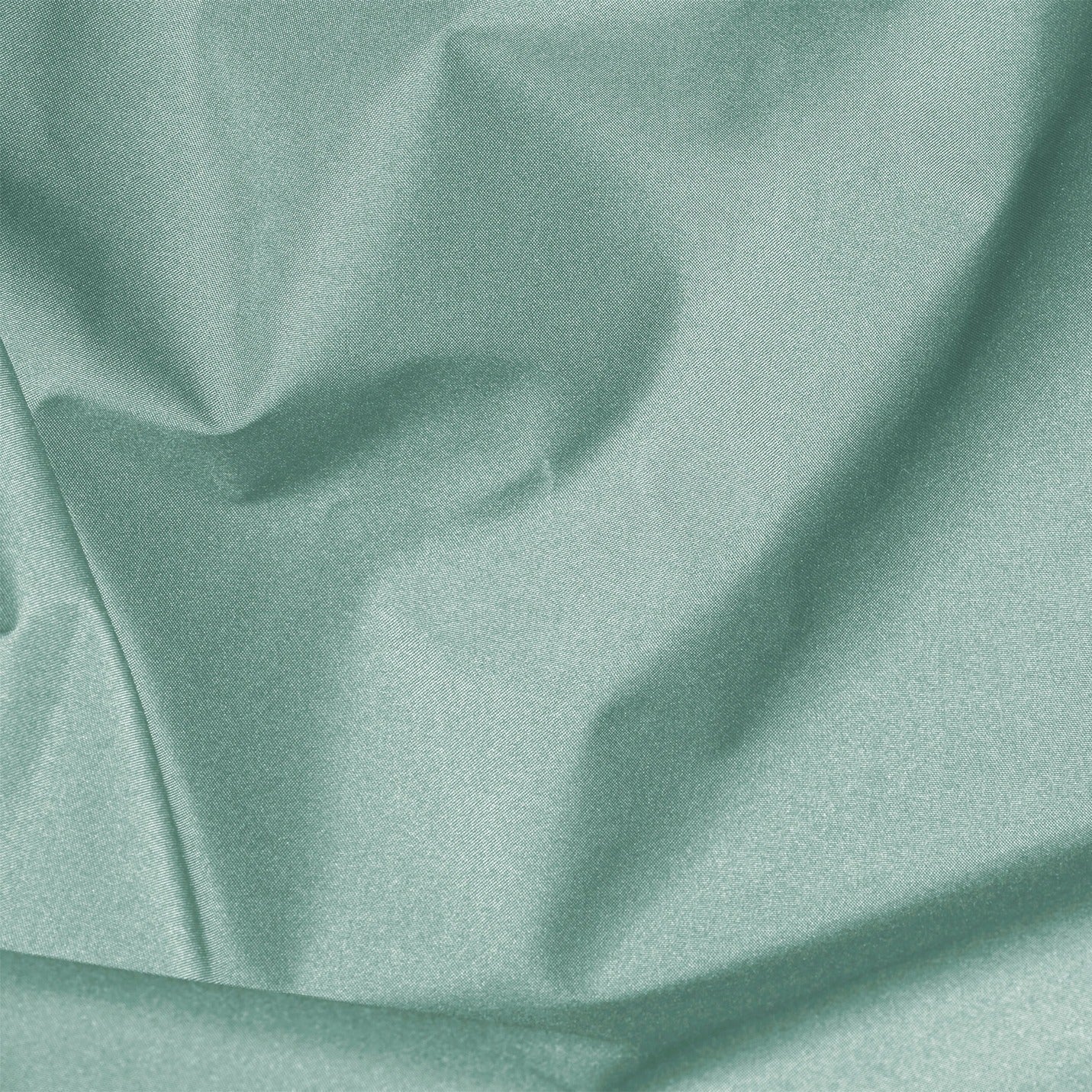 Close-up of teal fabric with folds