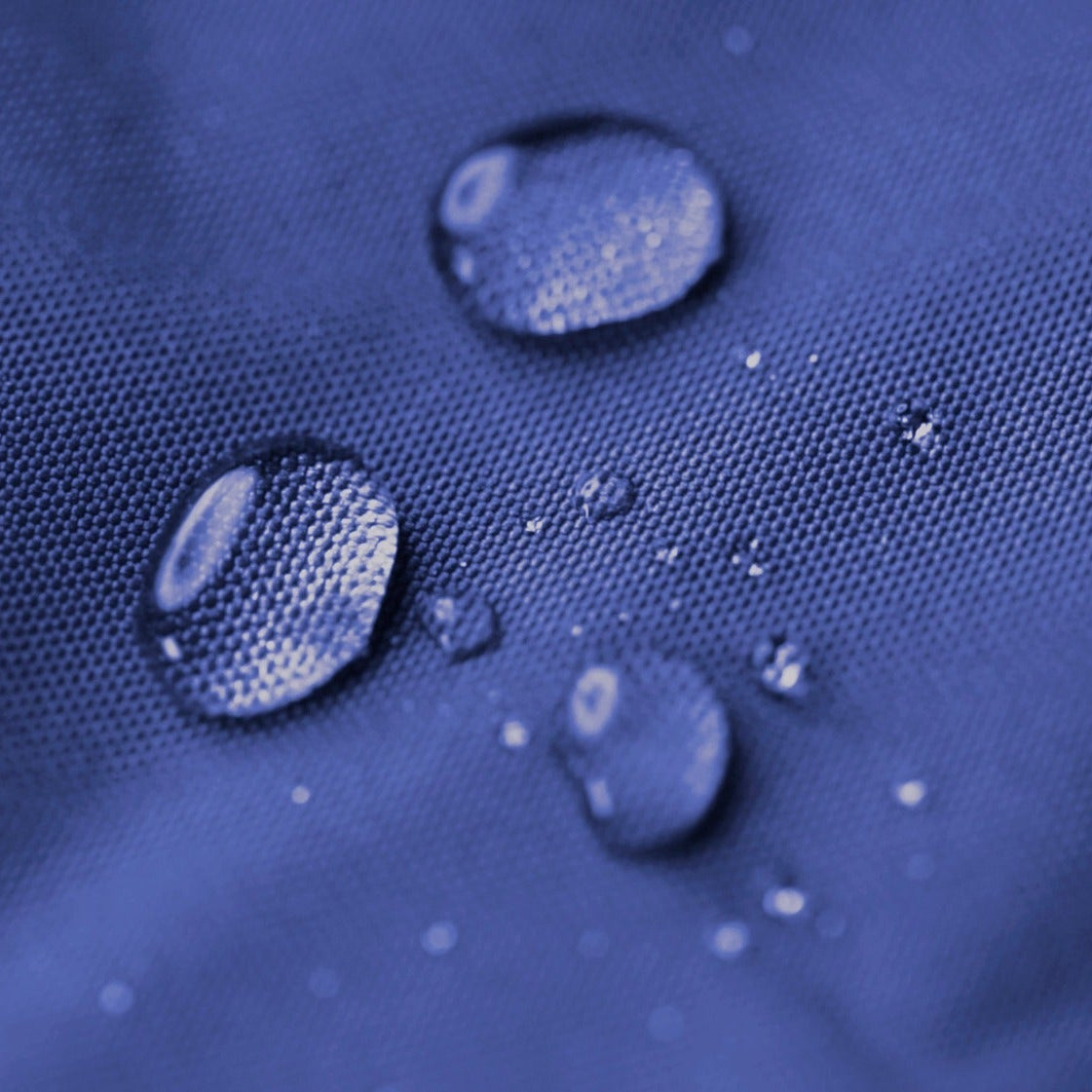Water droplets on a textured blue surface