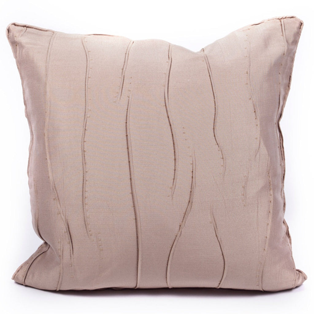 Beige pillow with wavy texture on a white background