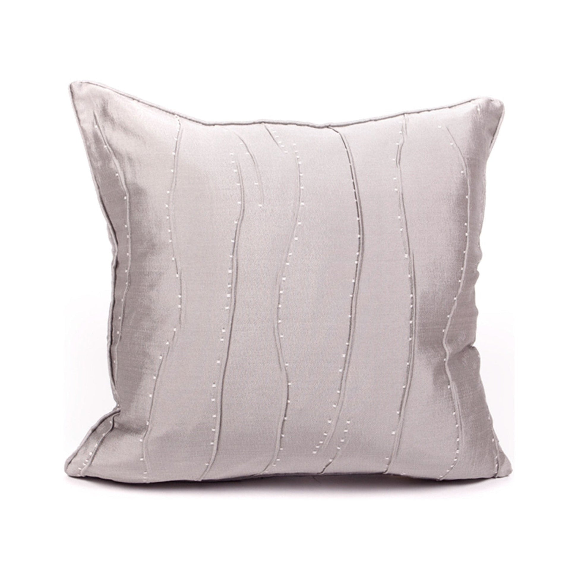 Gray pillow with decorative stitching on a white background