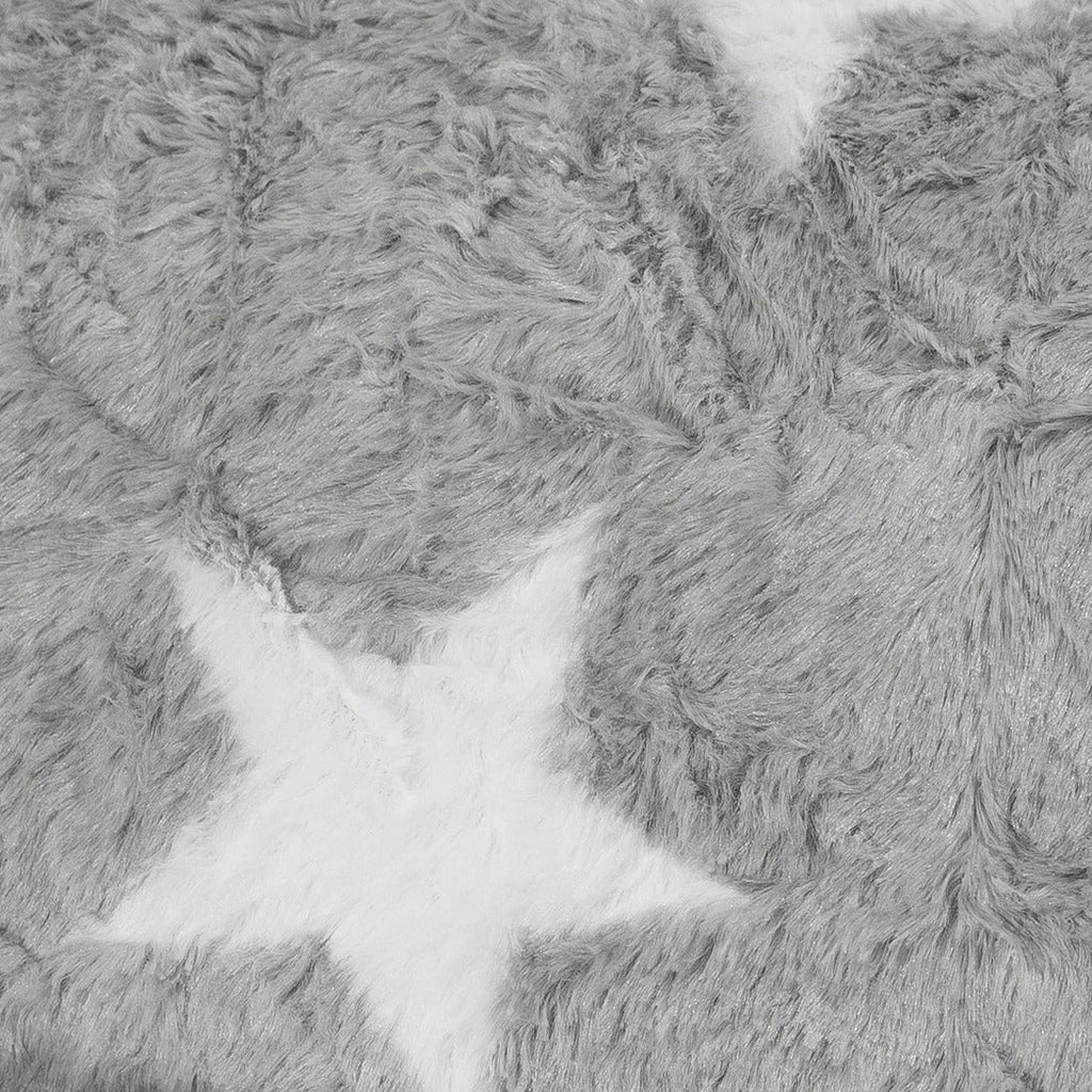 Close-up of a textured gray fabric with star patterns