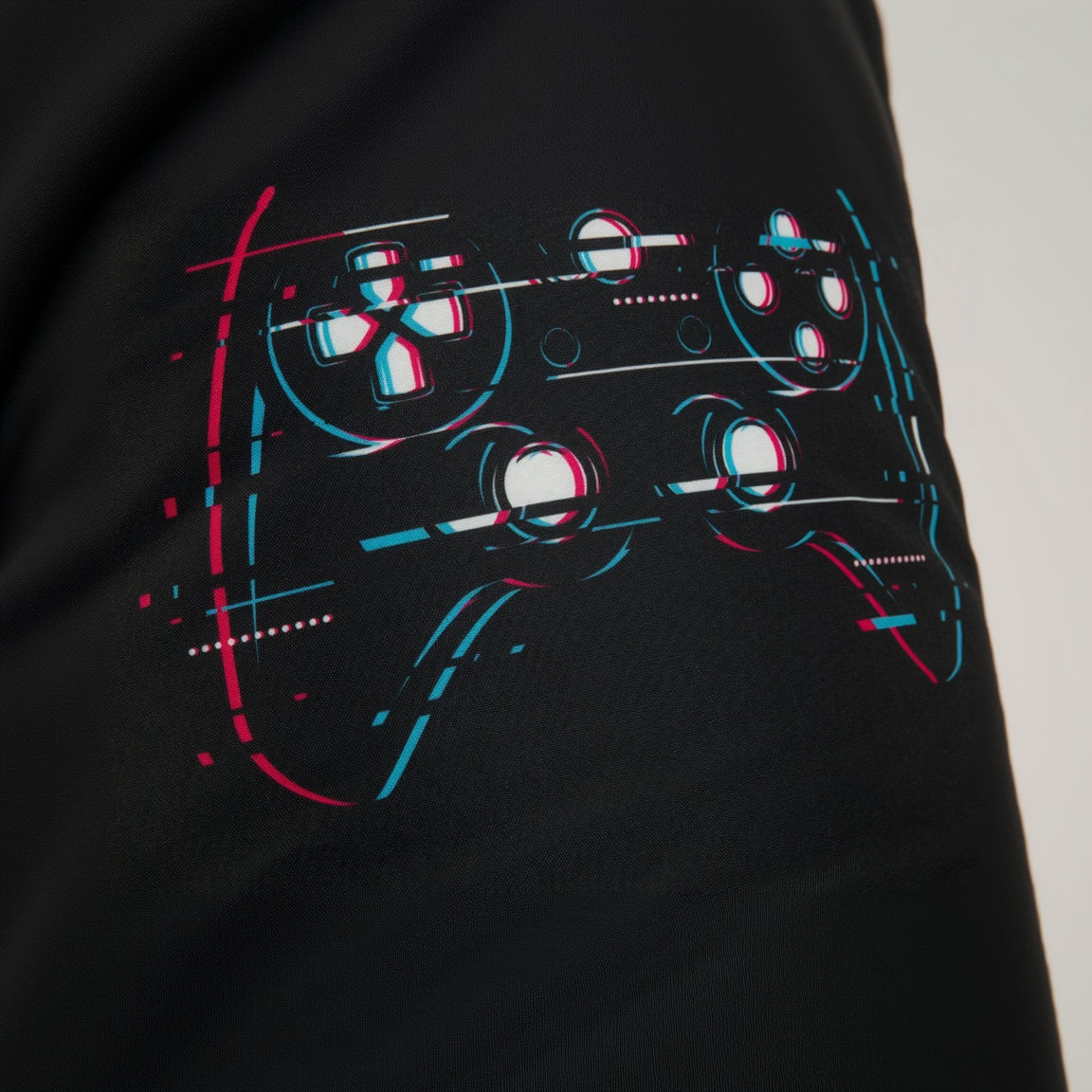 Black jacket with a graphic design of a gaming controller on a white background