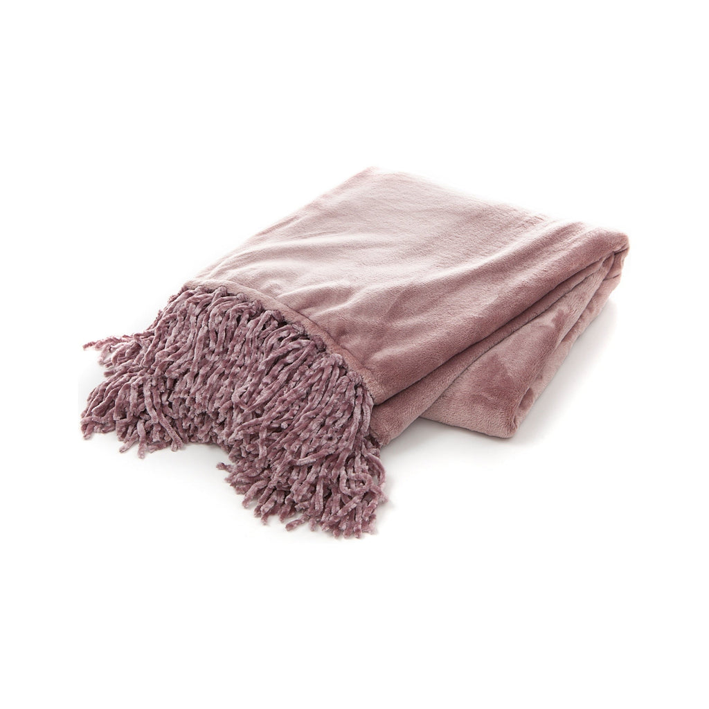 Folded pink blanket with tassels on a white background