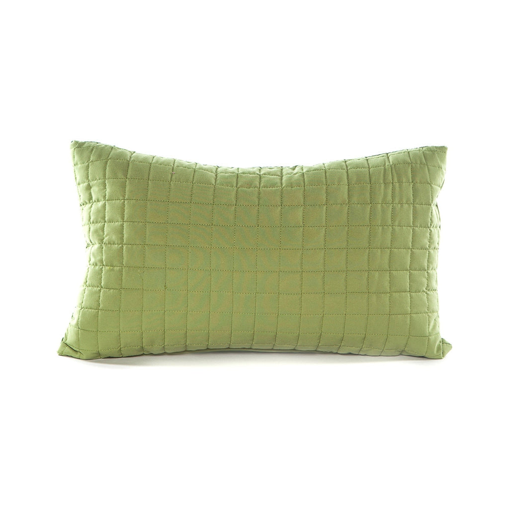 Green quilted pillow on a white background