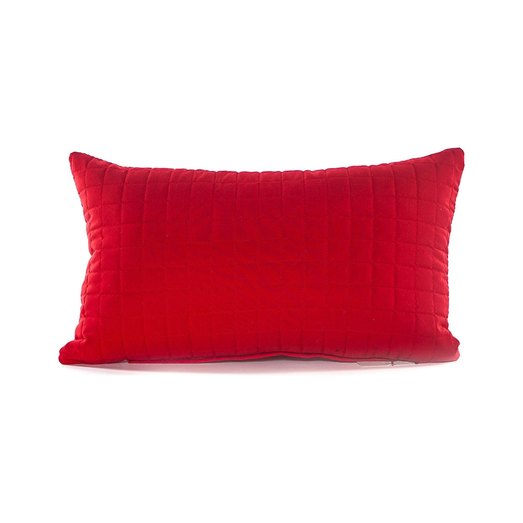 Red quilted pillow on a white background