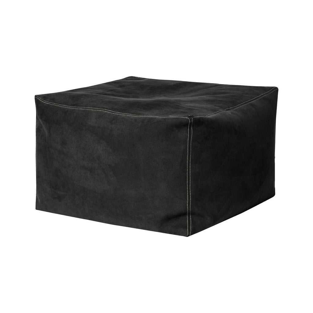 Black cube-shaped ottoman on a white background