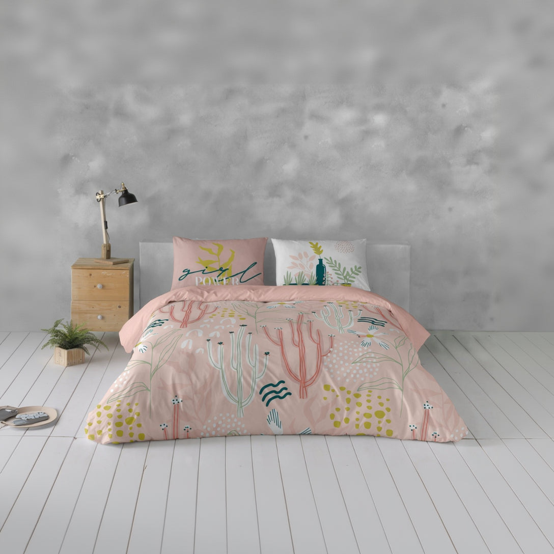 Bed with pink cactus-themed bedding
