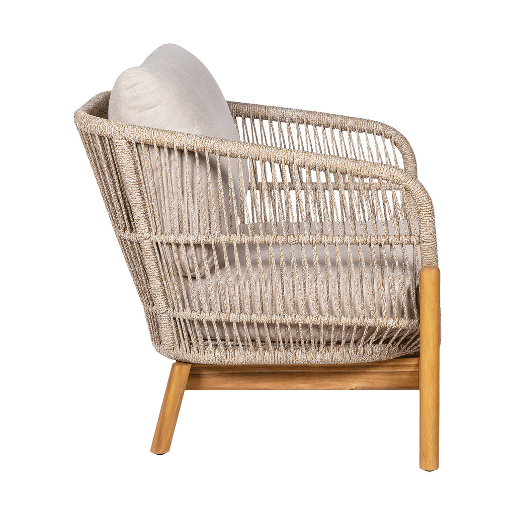 Wicker armchair with wooden legs on a white background