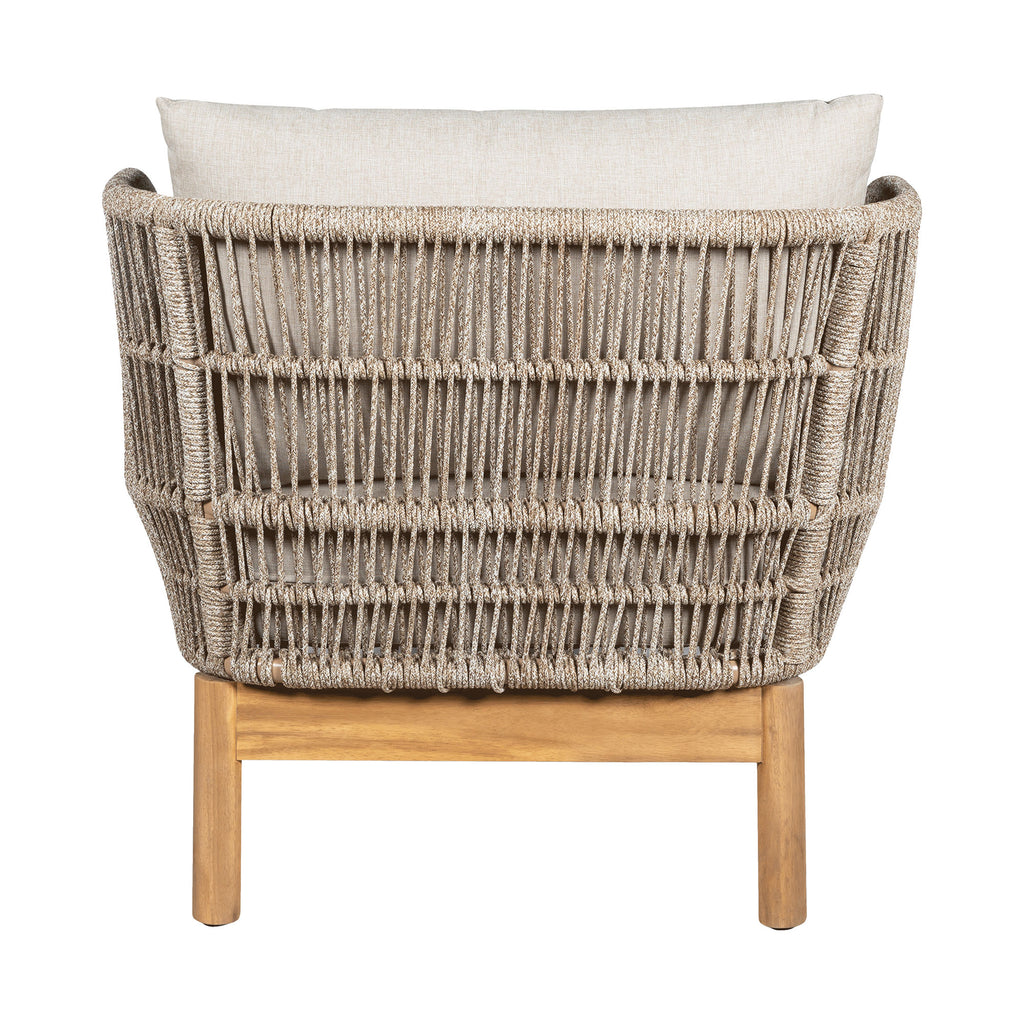 Wicker chair with wooden legs and a white cushion on a white background