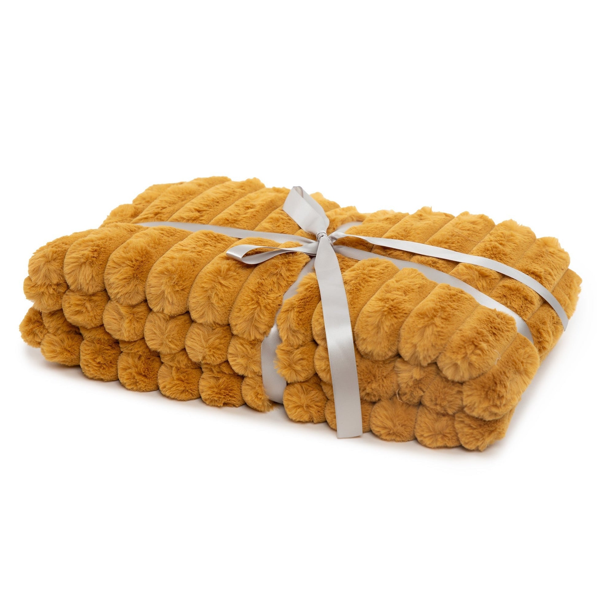 Yellow plush blanket tied with a ribbon on a white background