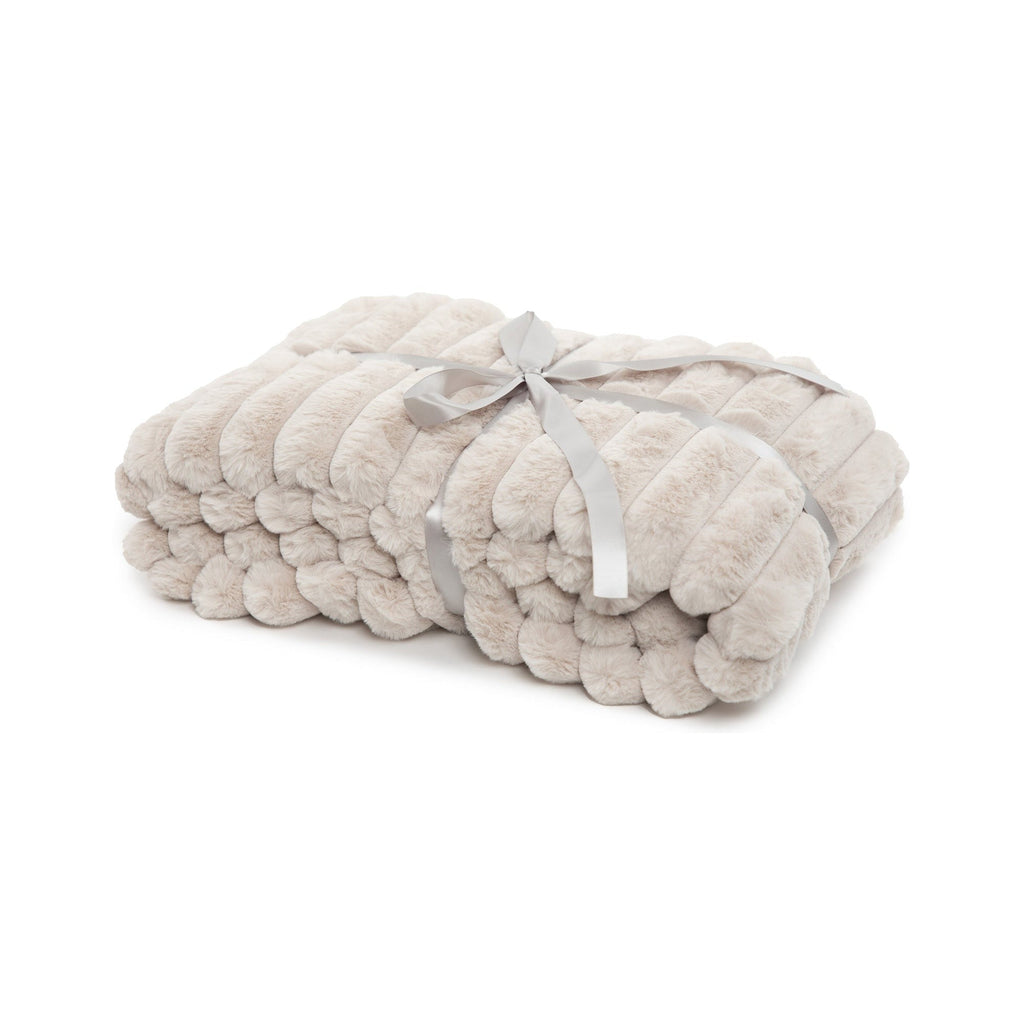 Folded beige blanket with a gray ribbon on a white background