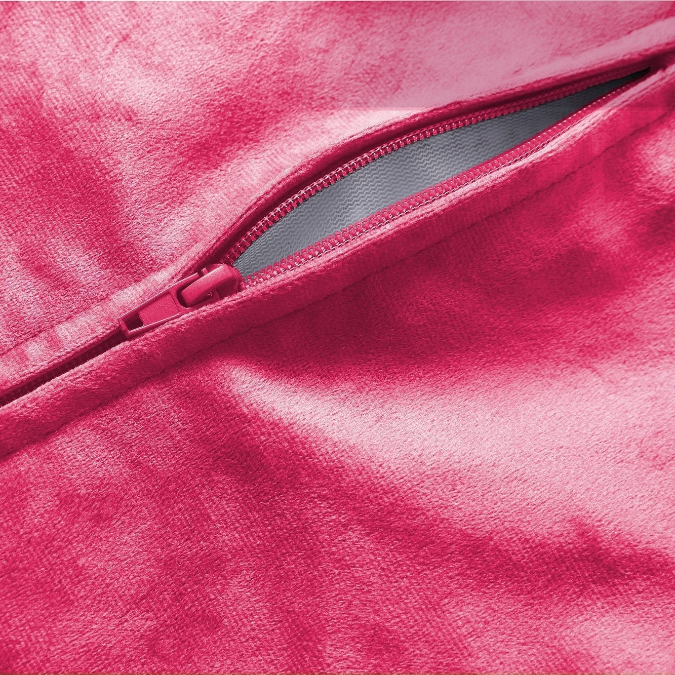 Close-up of a pink fabric with a zipper