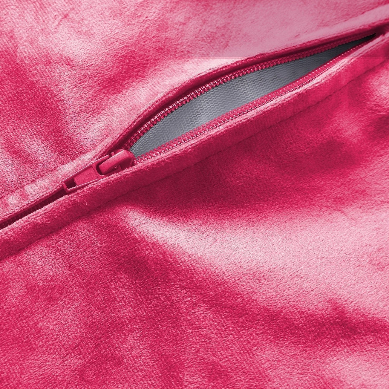 Close-up of a pink fabric with a zipper