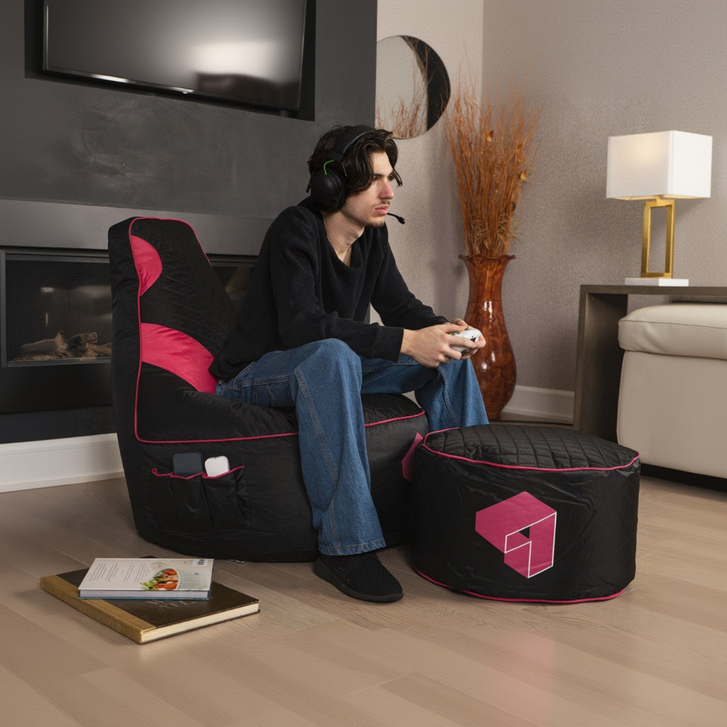Person sitting on a black and pink bean bag chair in a living room setting.