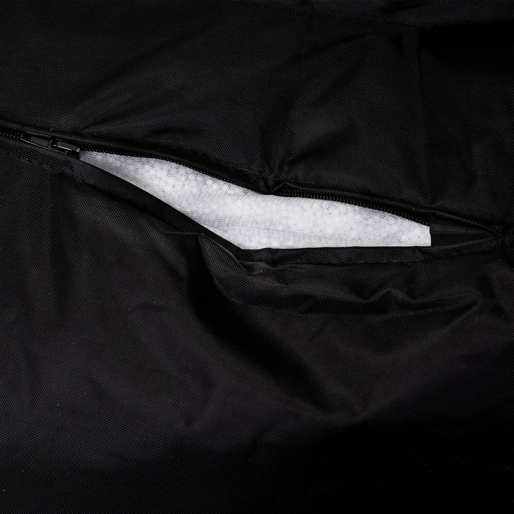 Close-up of a black bag interior with white foam padding