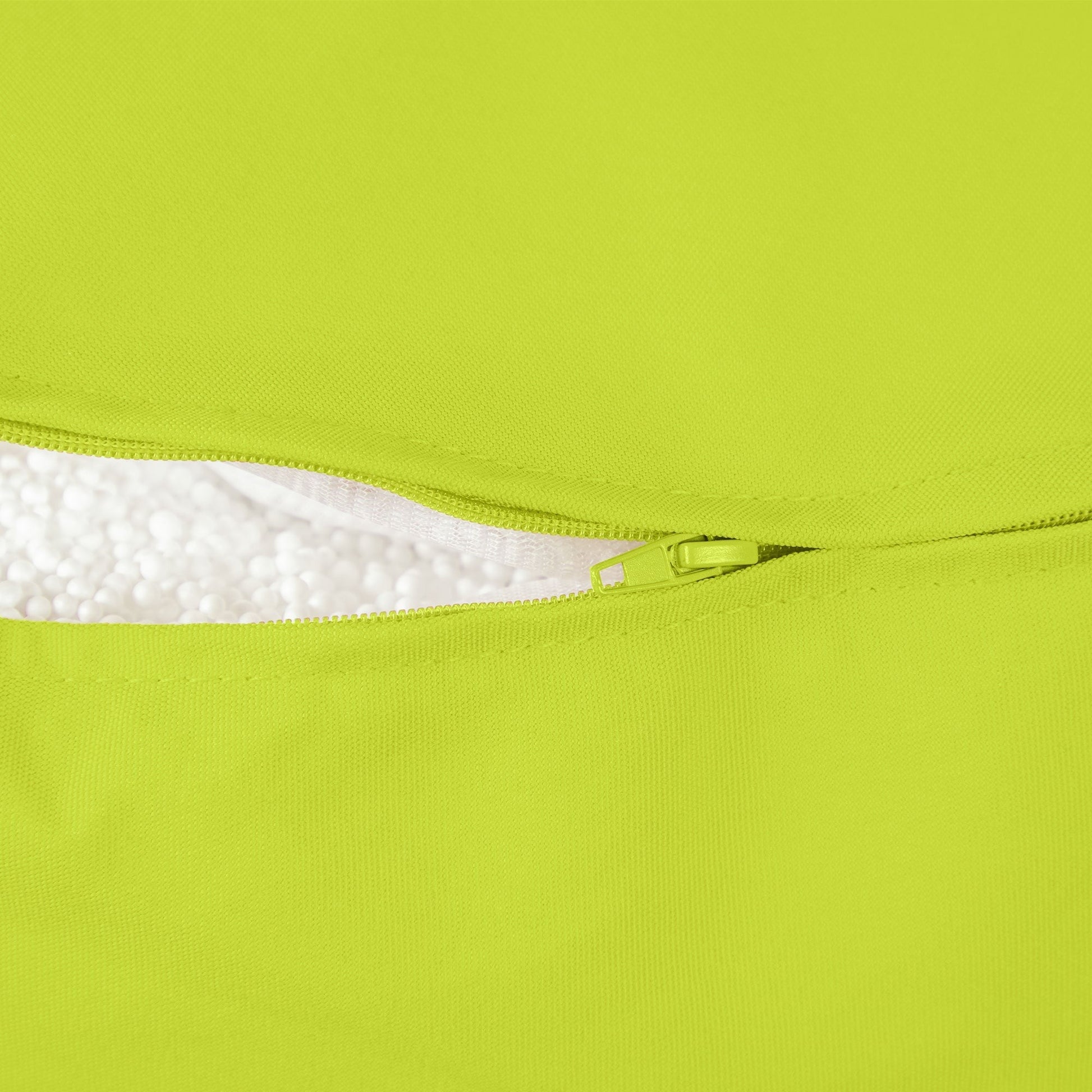 Close-up of a green fabric with a zipper and white interior lining.