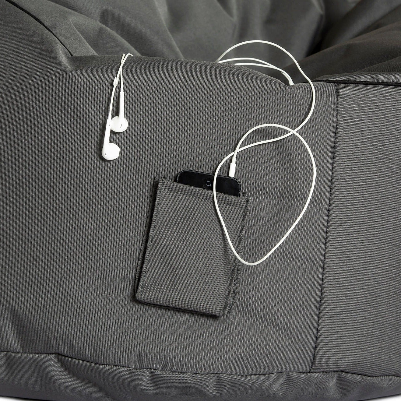 Gray bean bag with a pocket and earphones on a white background