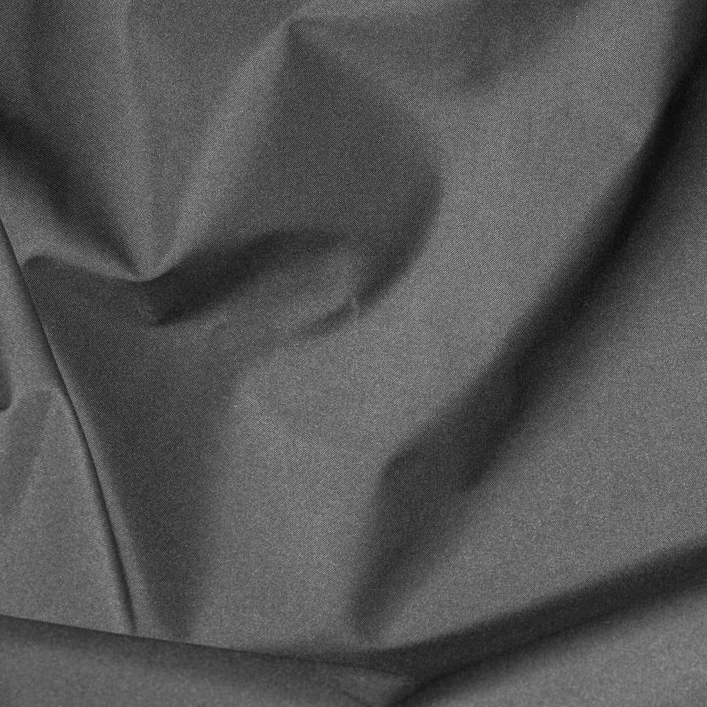 Close-up of dark gray fabric with folds