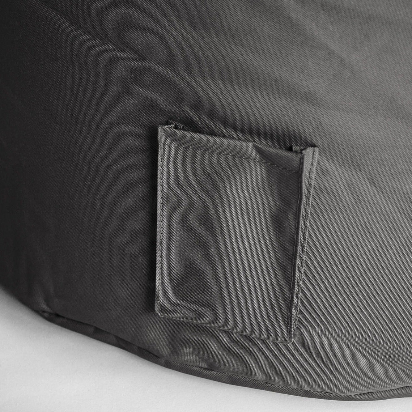 Gray fabric bag with a pocket on a white background