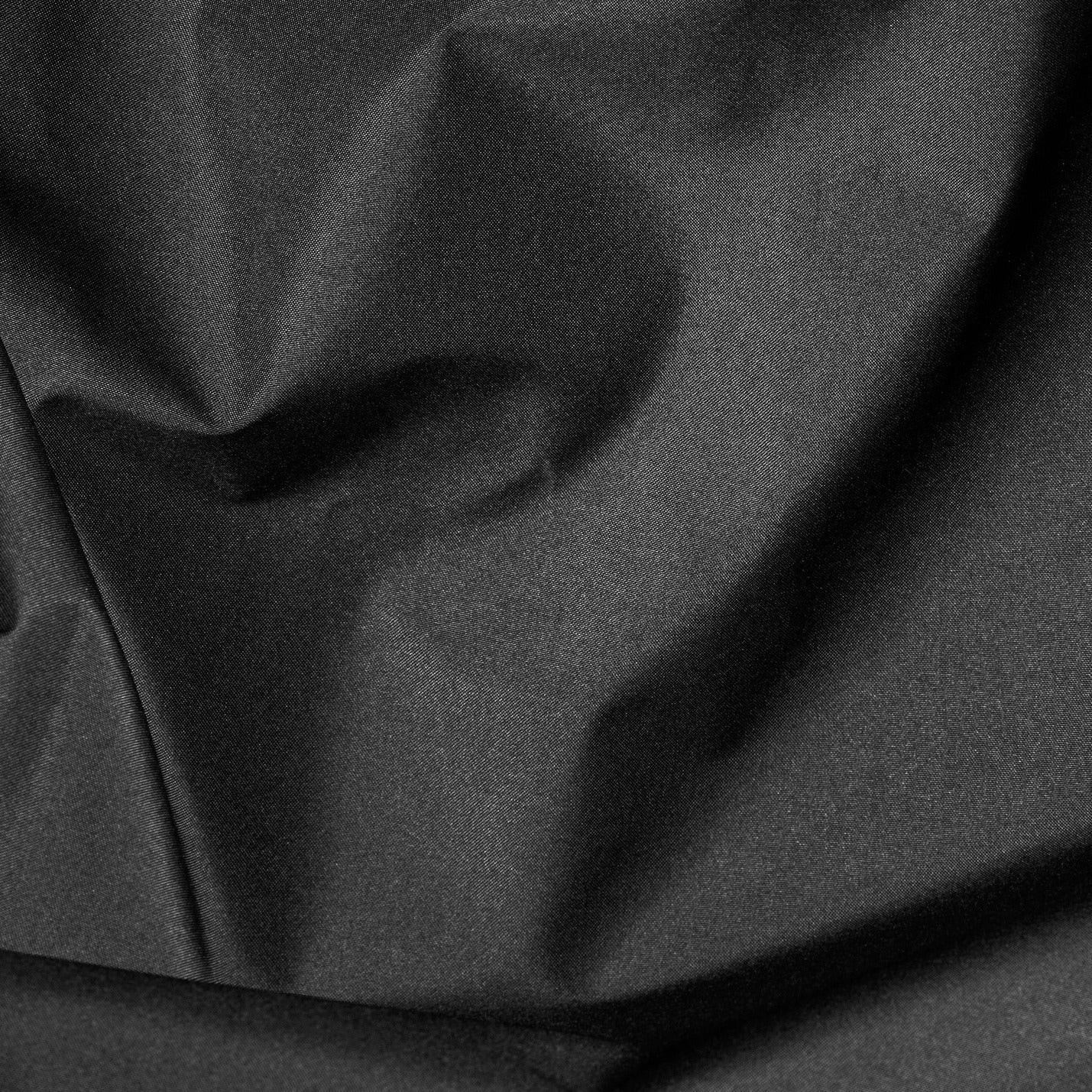 Close-up of black fabric with folds